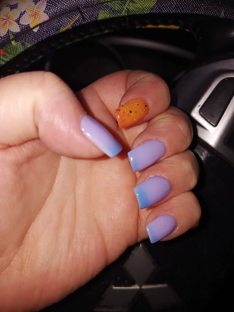 Lavender square nails with orange glitter accent nail