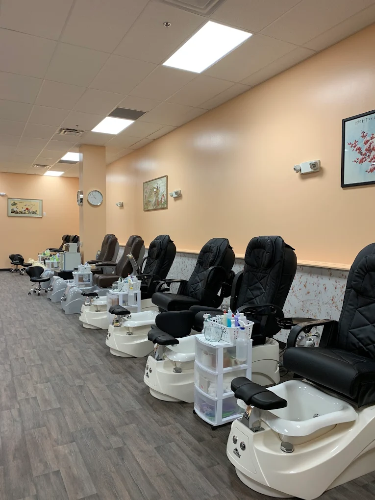 Row of pedicure spa chairs at Spa Nails